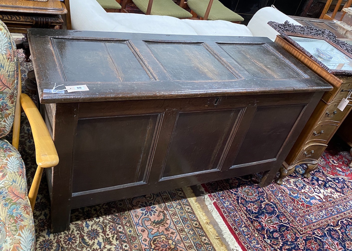 An early 18th century panelled oak coffer, length 136cm, depth 56cm, height 73cm